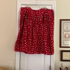 Red and white polka dot above the knee skirt.
